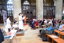 A lecture taking place in the North Transept of Peterborough Cathedral